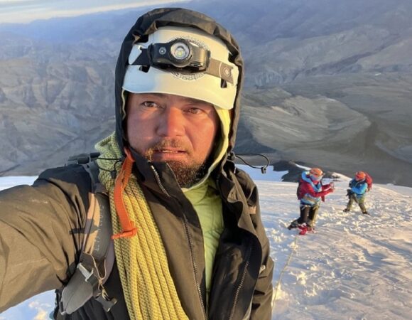 Determined mountain guide ascending Kangyatse 2, leading climbers safely towards the summit.