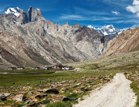 A panoramic view of Kun Peak rising above the Ladakh landscape.