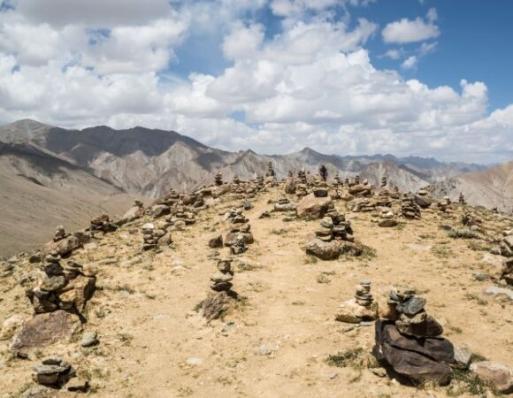 A breathtaking view of the Markha Valley, with rugged mountains and lush greenery.