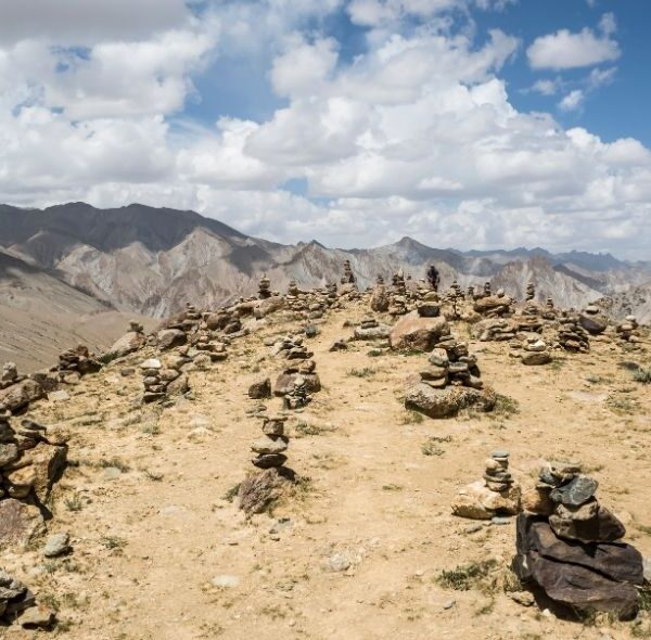 A breathtaking view of the Markha Valley, with rugged mountains and lush greenery.