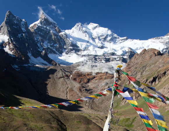 Tranquil scene of Kun Peak framed against a clear blue sky.