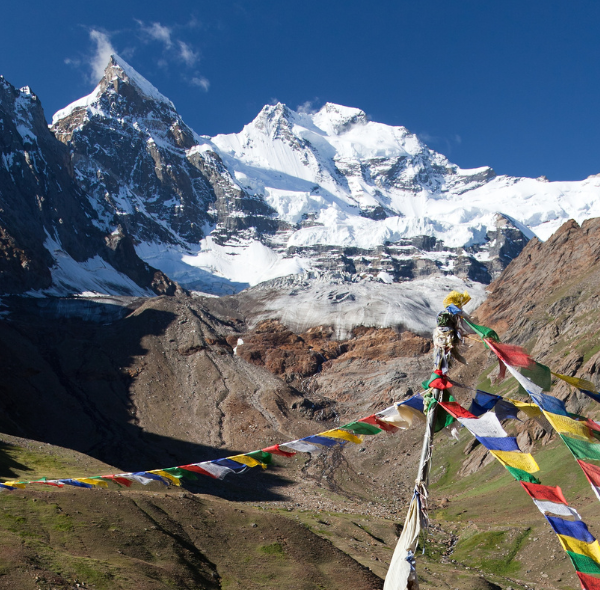 Tranquil scene of Kun Peak framed against a clear blue sky.