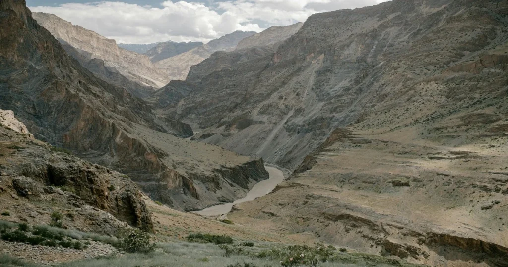  A trekking trail surrounded by rugged mountains in Zanskar Valley, Leh Ladakh.